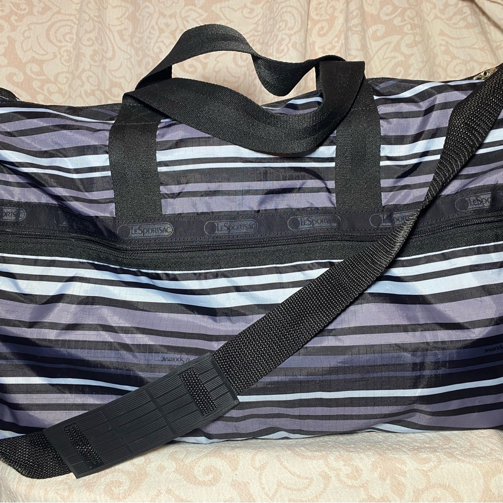 New LeSportsac Deluxe Large Weekender Black, Purple and Blue Stripped Duffel Bag